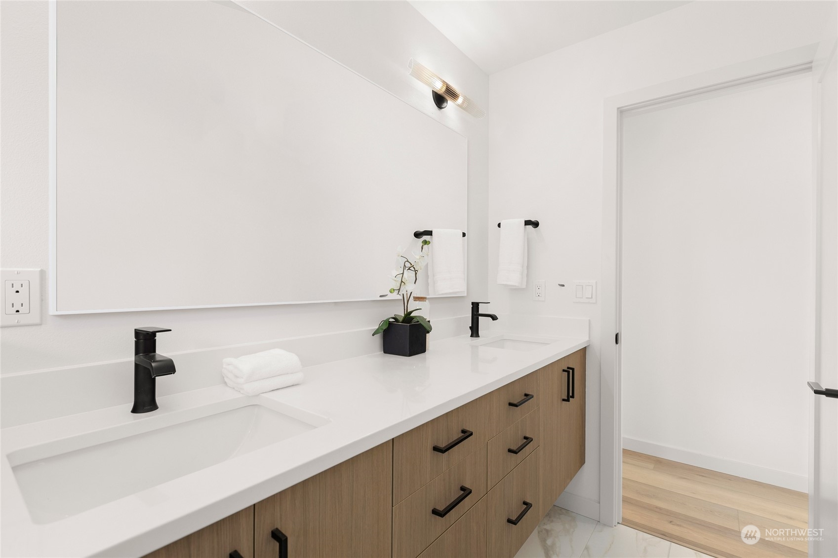 508 North 48th Street Seattle, WA 98103 - Photo 25 of 38 a bathroom with a sink and a mirror