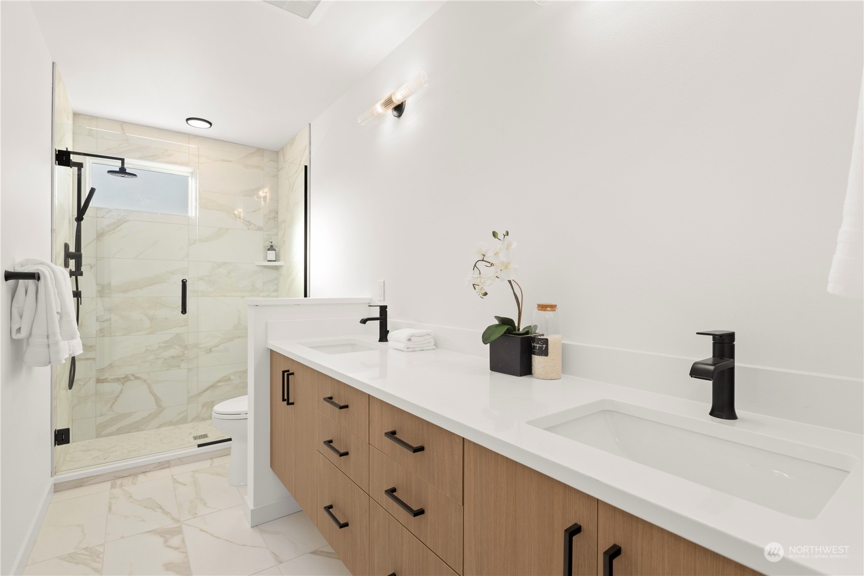 508 North 48th Street Seattle, WA 98103 - Photo 26 of 38 a bathroom with a double vanity sink mirror double and shower