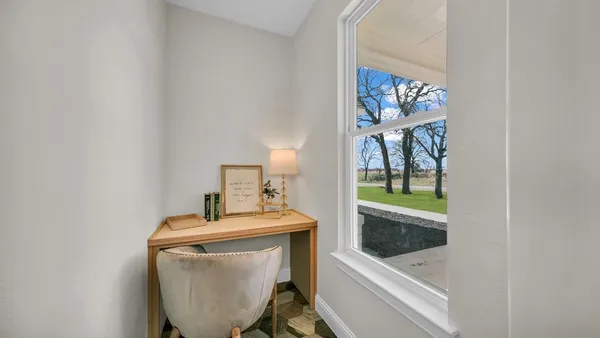 a kitchen with white cabinets and white appliances