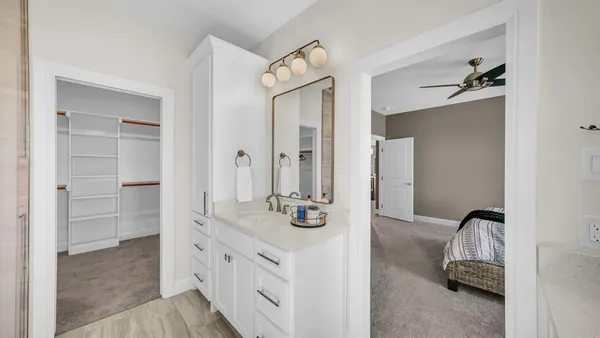 a kitchen with sink cabinets and wooden floor