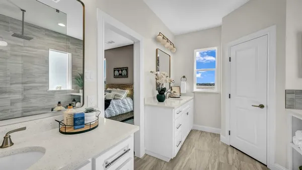 a view of hallway with stairs and wooden floor