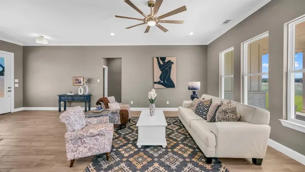 a living room with furniture and a window