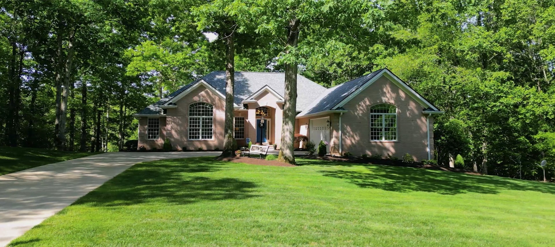 a front view of a house with a yard