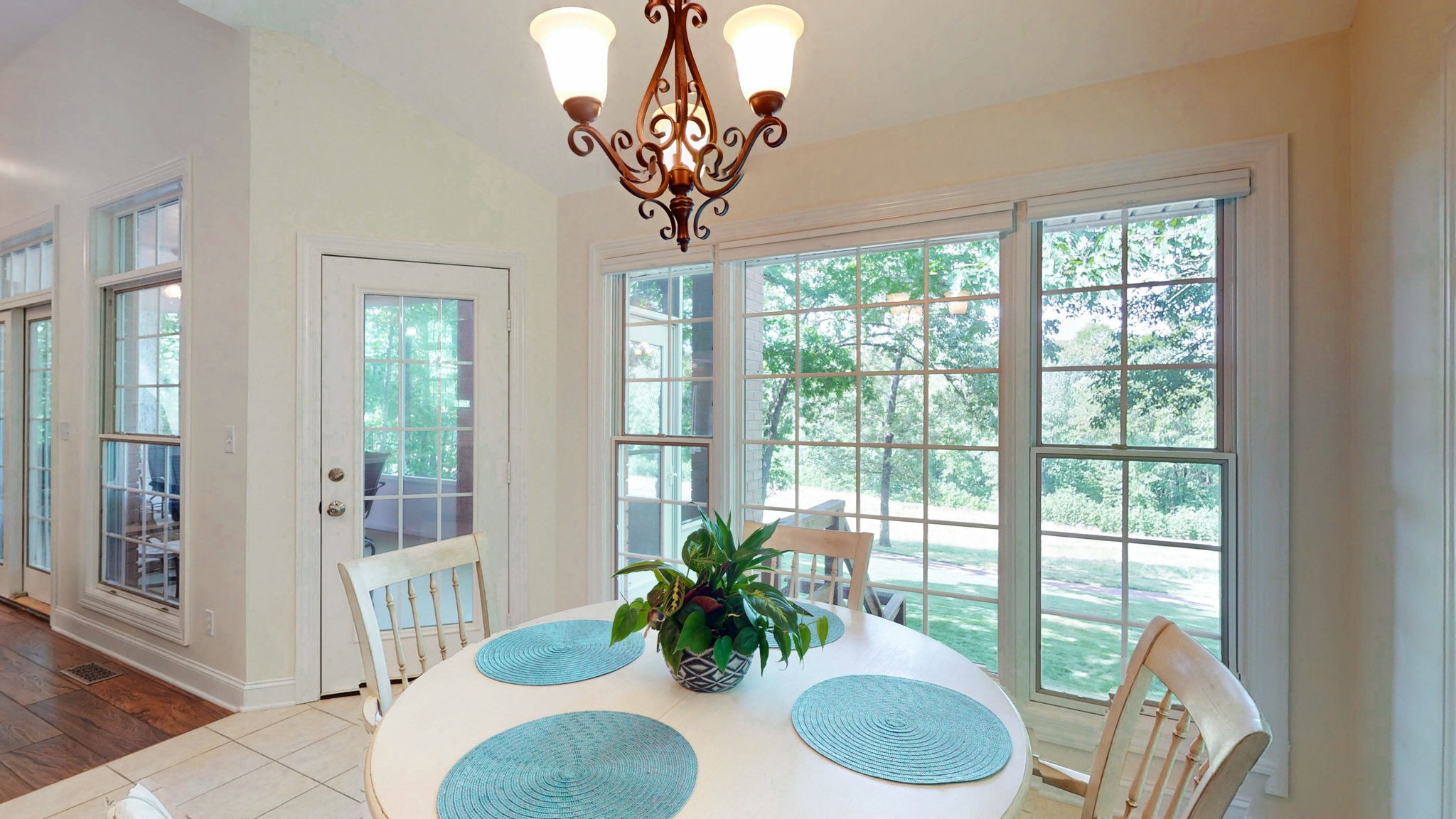 409 Legends Drive Springville, TN 38256 - Photo 11 of 51 a dining room with furniture potted plants and wooden floor