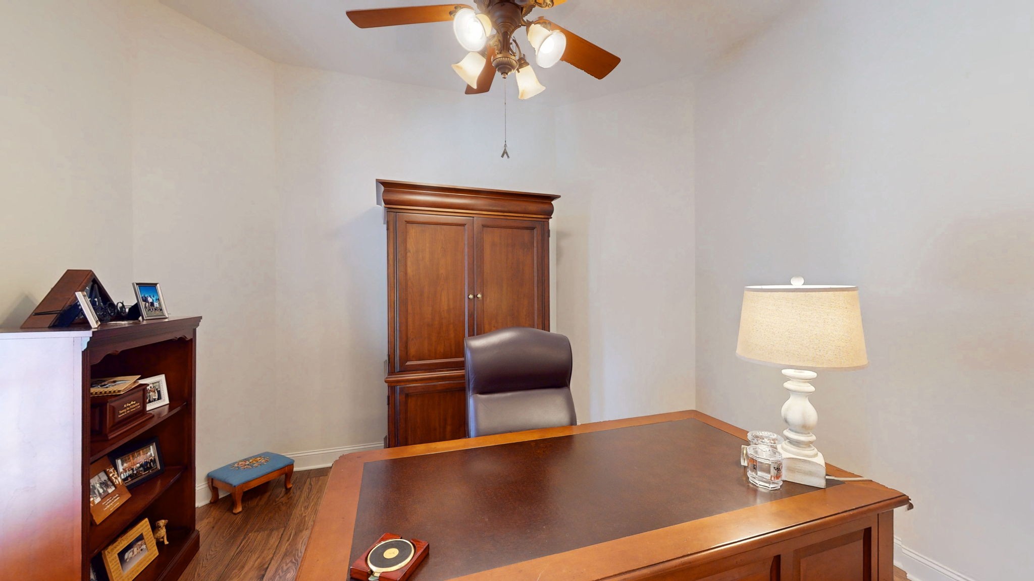 409 Legends Drive Springville, TN 38256 - Photo 14 of 51 a workspace with furniture and wooden floor