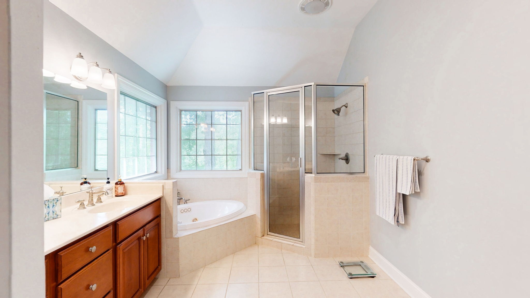 409 Legends Drive Springville, TN 38256 - Photo 17 of 51 a bathroom with a tub sink and mirror