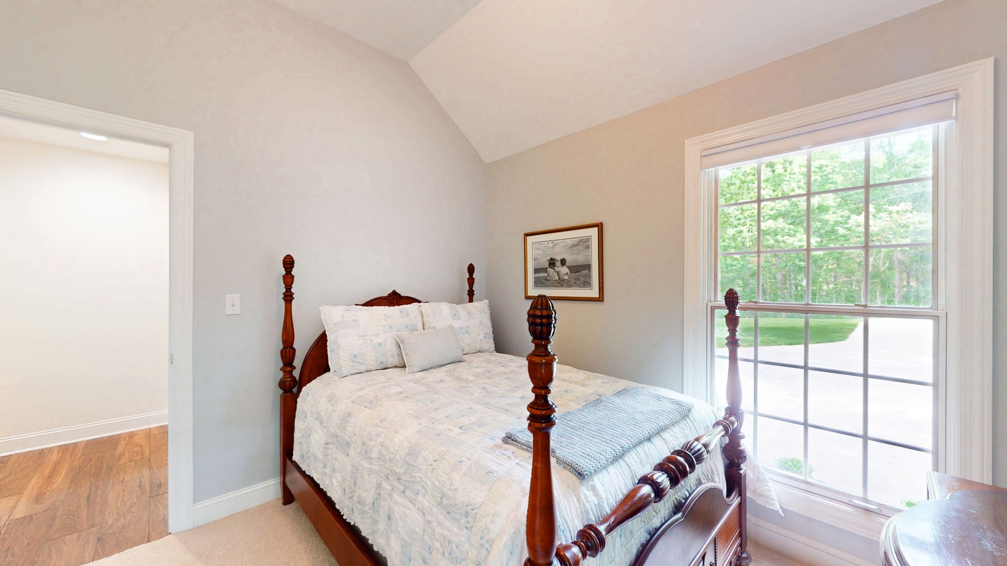 409 Legends Drive Springville, TN 38256 - Photo 22 of 51 a bed sitting in a bedroom next to a window
