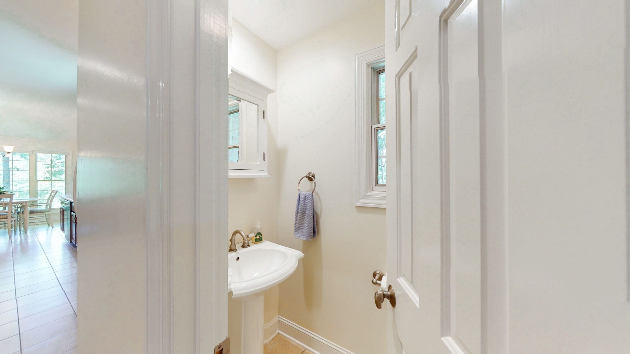 409 Legends Drive Springville, TN 38256 - Photo 24 of 51 a bathroom with a sink and mirror with toilet