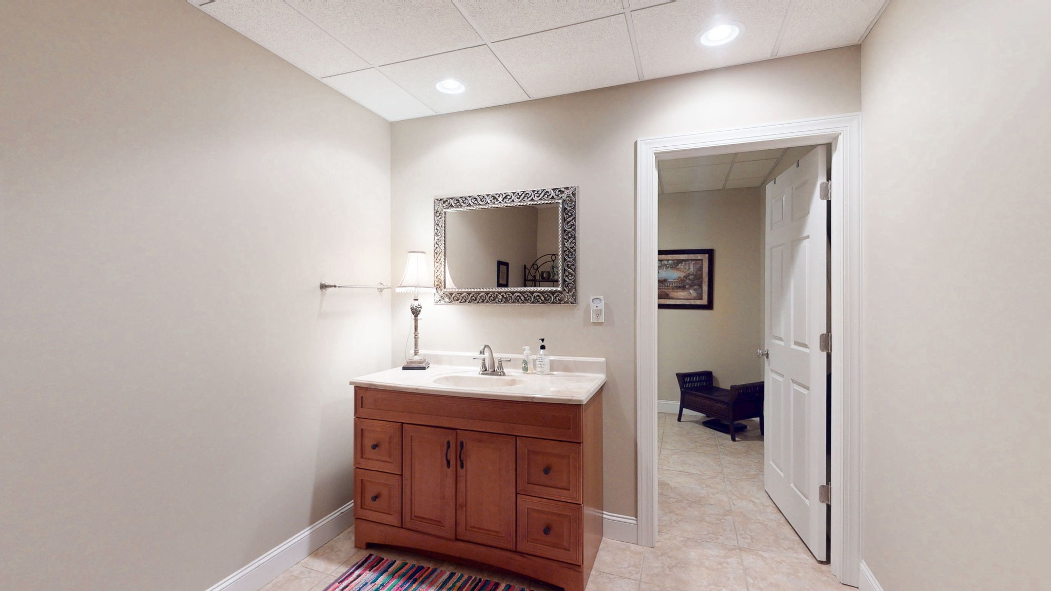 409 Legends Drive Springville, TN 38256 - Photo 30 of 51 a bathroom with a sink and a mirror