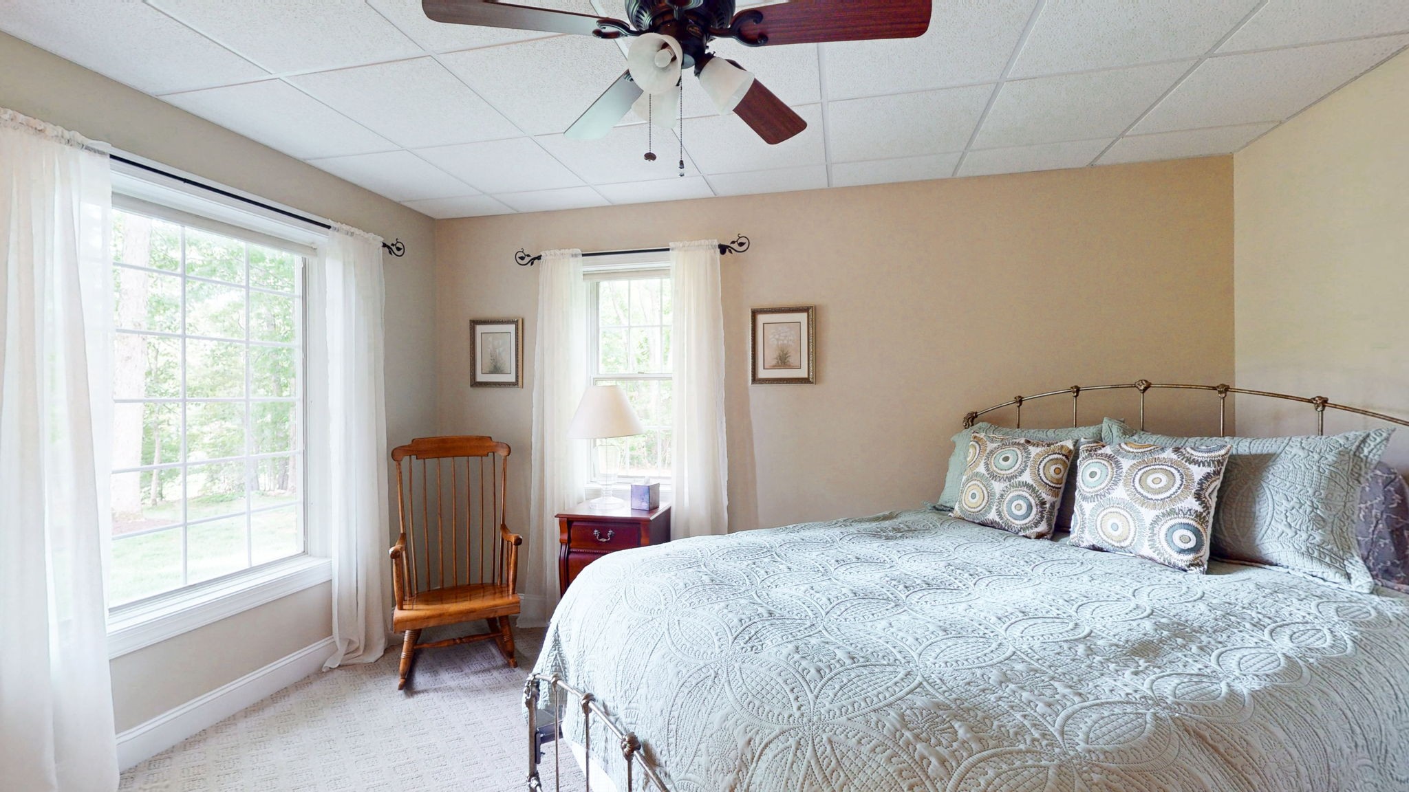 409 Legends Drive Springville, TN 38256 - Photo 32 of 51 a bedroom with a bed and a chandelier
