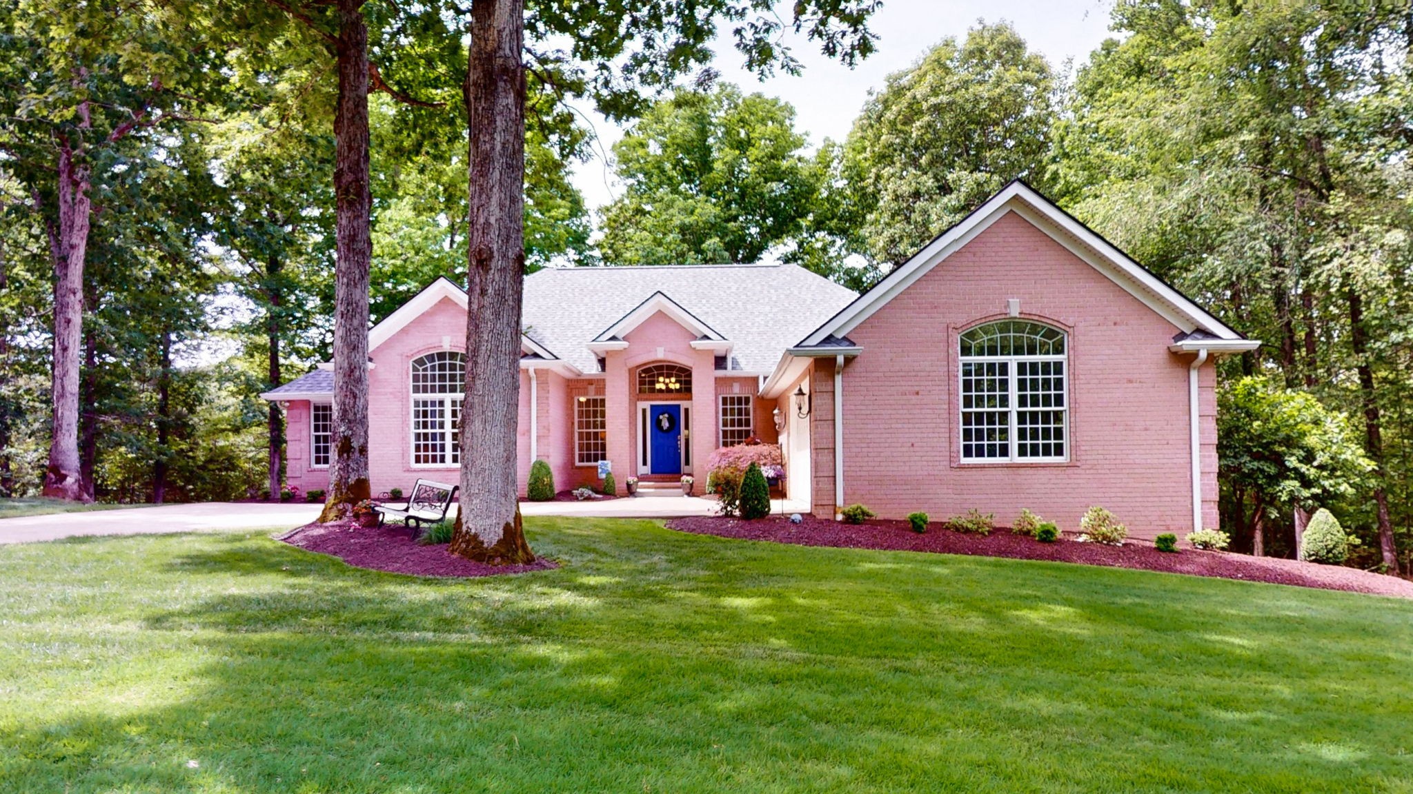 409 Legends Drive Springville, TN 38256 - Photo 38 of 51 a front view of a house with a yard and trees