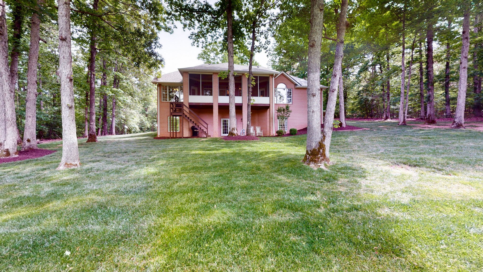 409 Legends Drive Springville, TN 38256 - Photo 43 of 51 a view of a house with a big yard and large trees