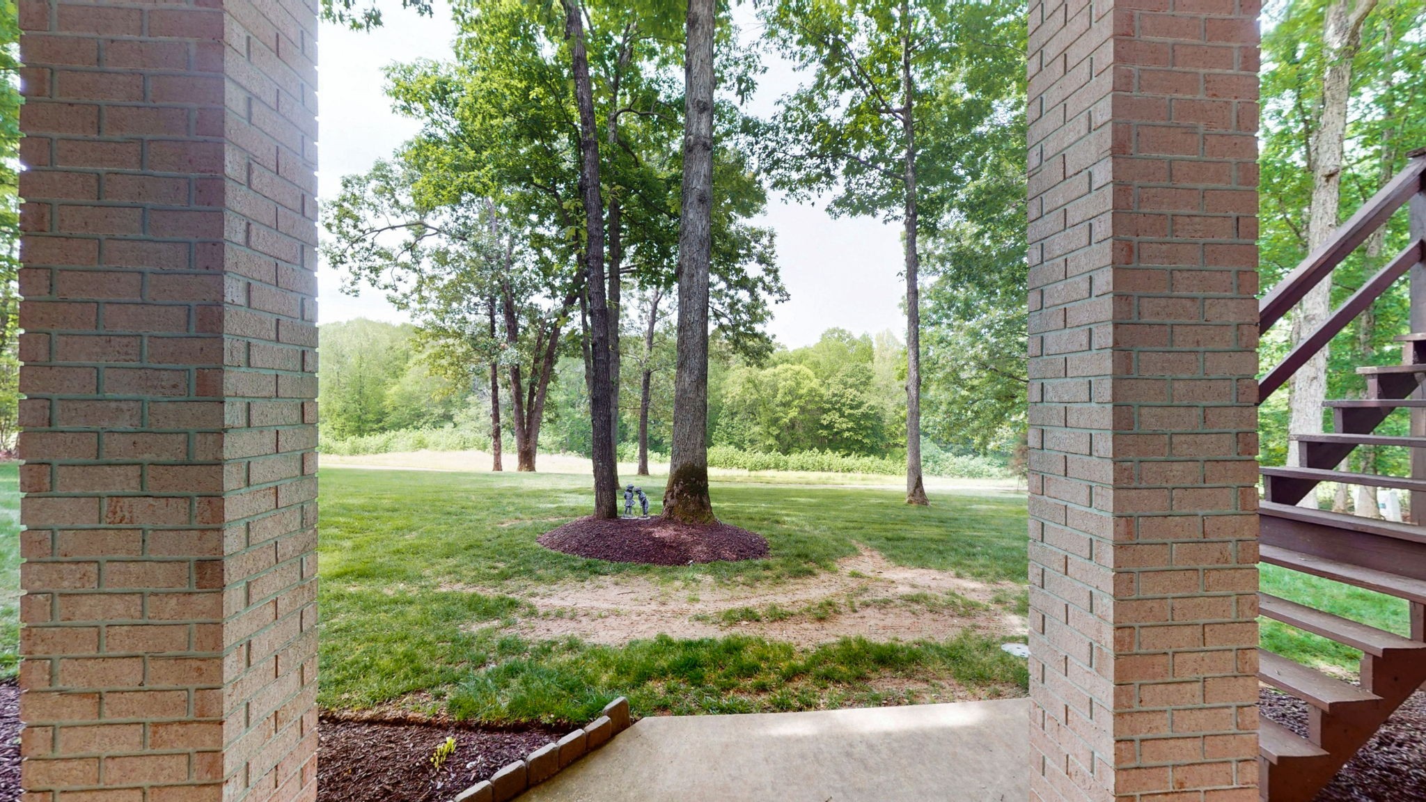 409 Legends Drive Springville, TN 38256 - Photo 45 of 51 a backyard of a house with lots of green space
