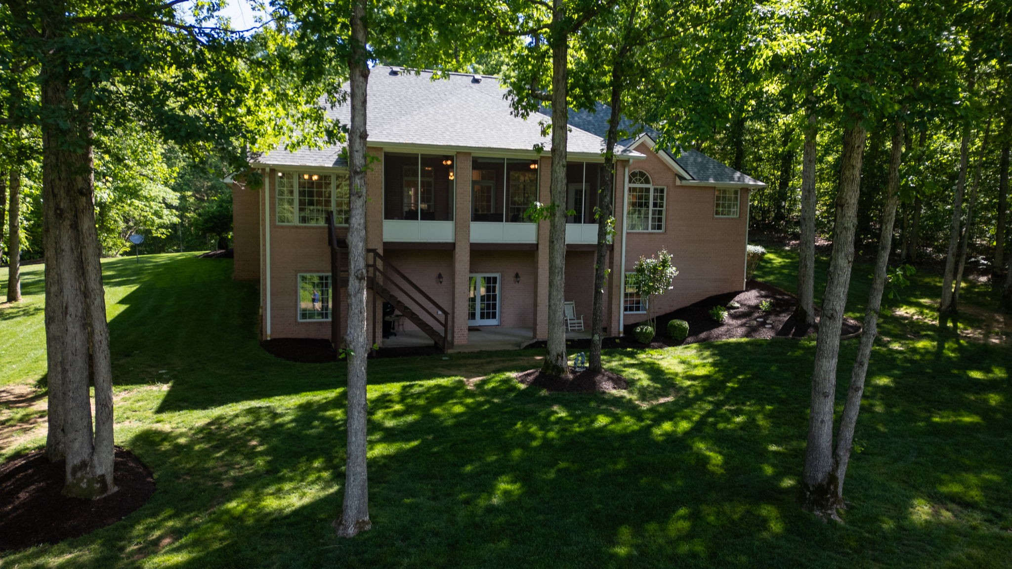 409 Legends Drive Springville, TN 38256 - Photo 49 of 51 a backyard of a house with table and chairs