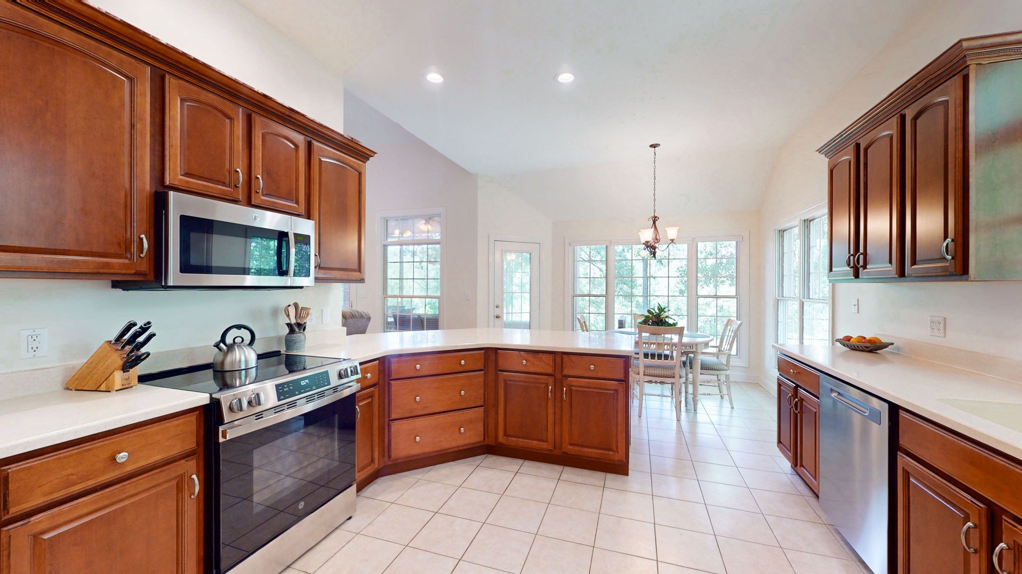 409 Legends Drive Springville, TN 38256 - Photo 6 of 51 a kitchen with stainless steel appliances granite countertop a sink and cabinets