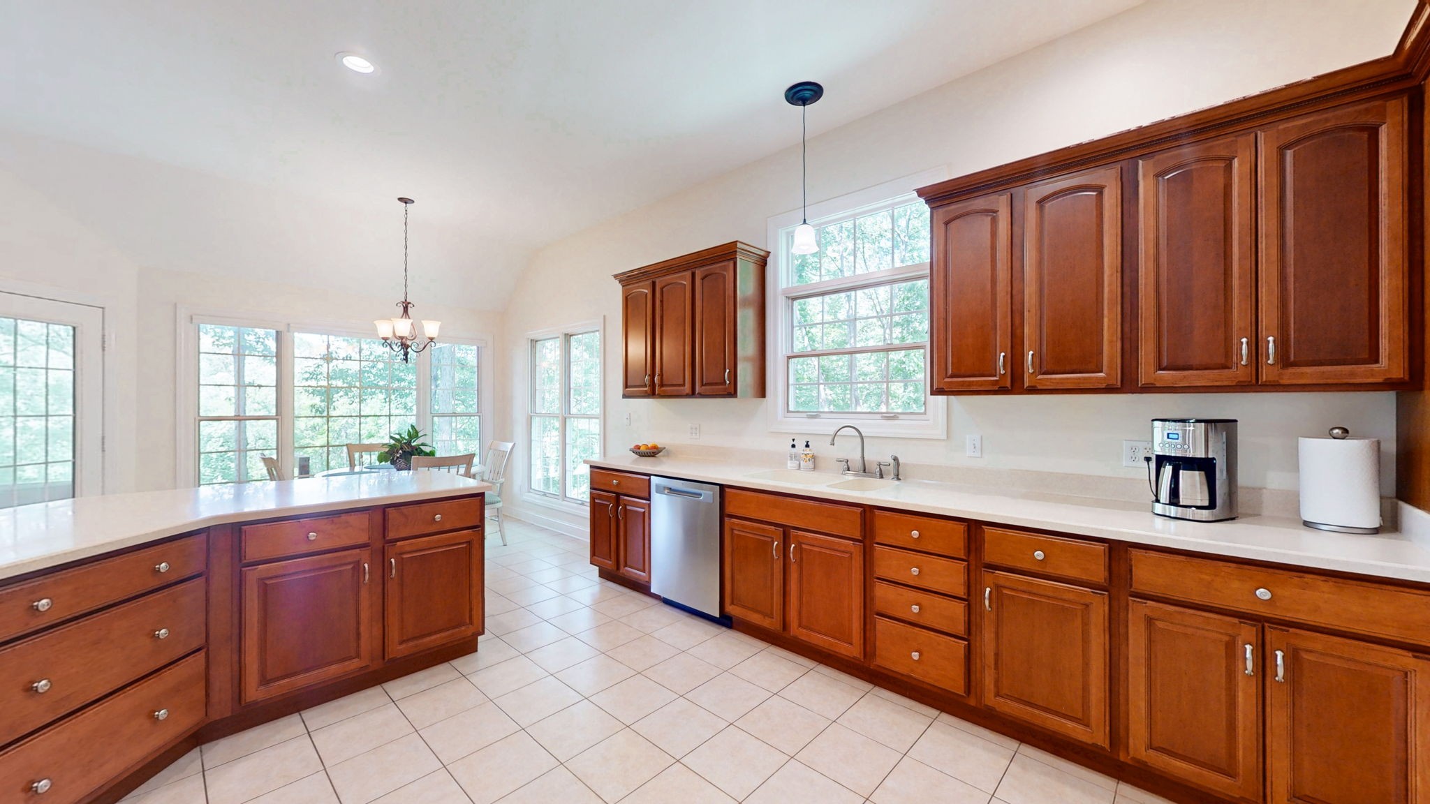 409 Legends Drive Springville, TN 38256 - Photo 7 of 51 a kitchen with stainless steel appliances granite countertop wooden cabinets a stove a sink and a window