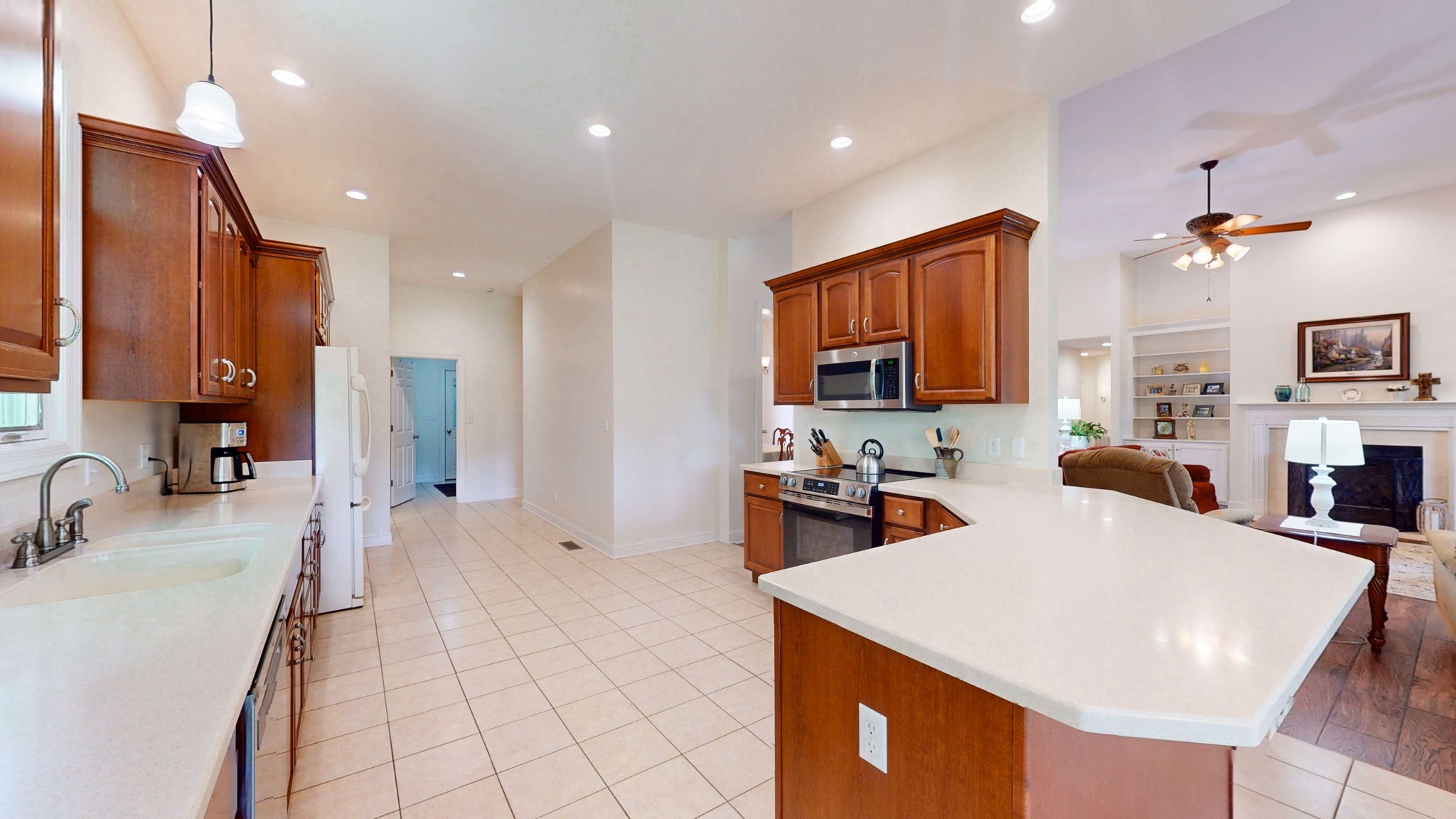 409 Legends Drive Springville, TN 38256 - Photo 8 of 51 a large kitchen with sink a counter top space and appliances