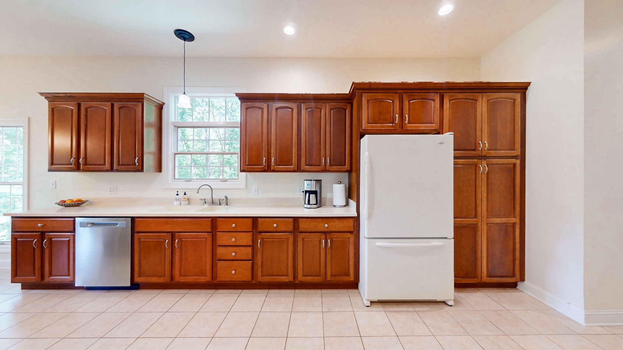 409 Legends Drive Springville, TN 38256 - Photo 9 of 51 a kitchen with a refrigerator sink and cabinets