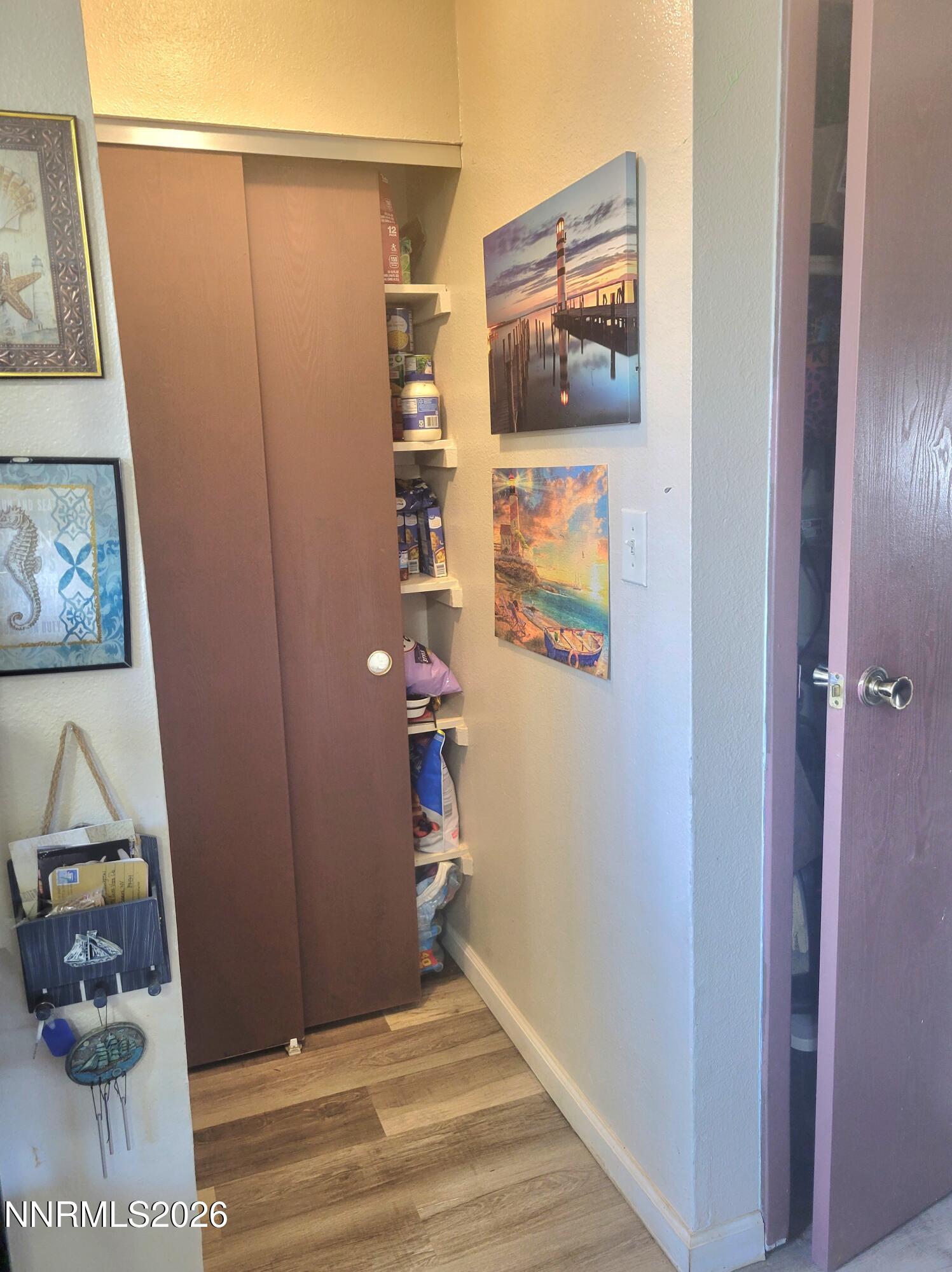 1404 East 9th Street, Unit 3 Reno, NV 89512 - Photo 10 of 29 a view of a hallway with wooden floor and closet
