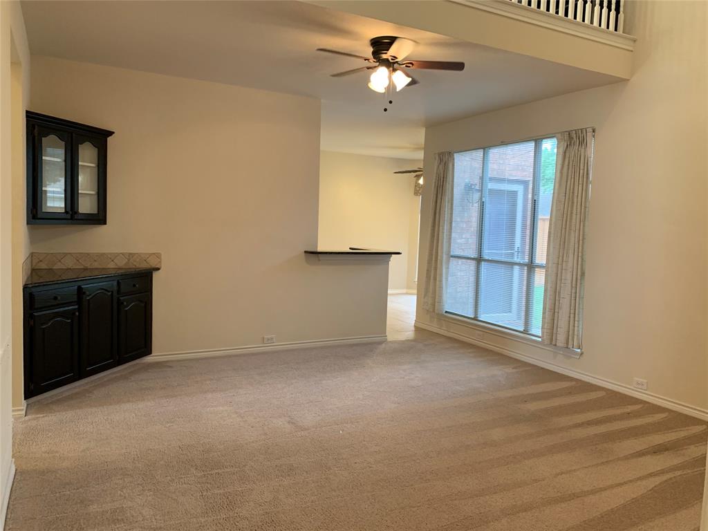 5009 Promise Land Drive Frisco, TX 75035 - Photo 2 of 9 Unfurnished living room featuring light carpet and a ceiling fan