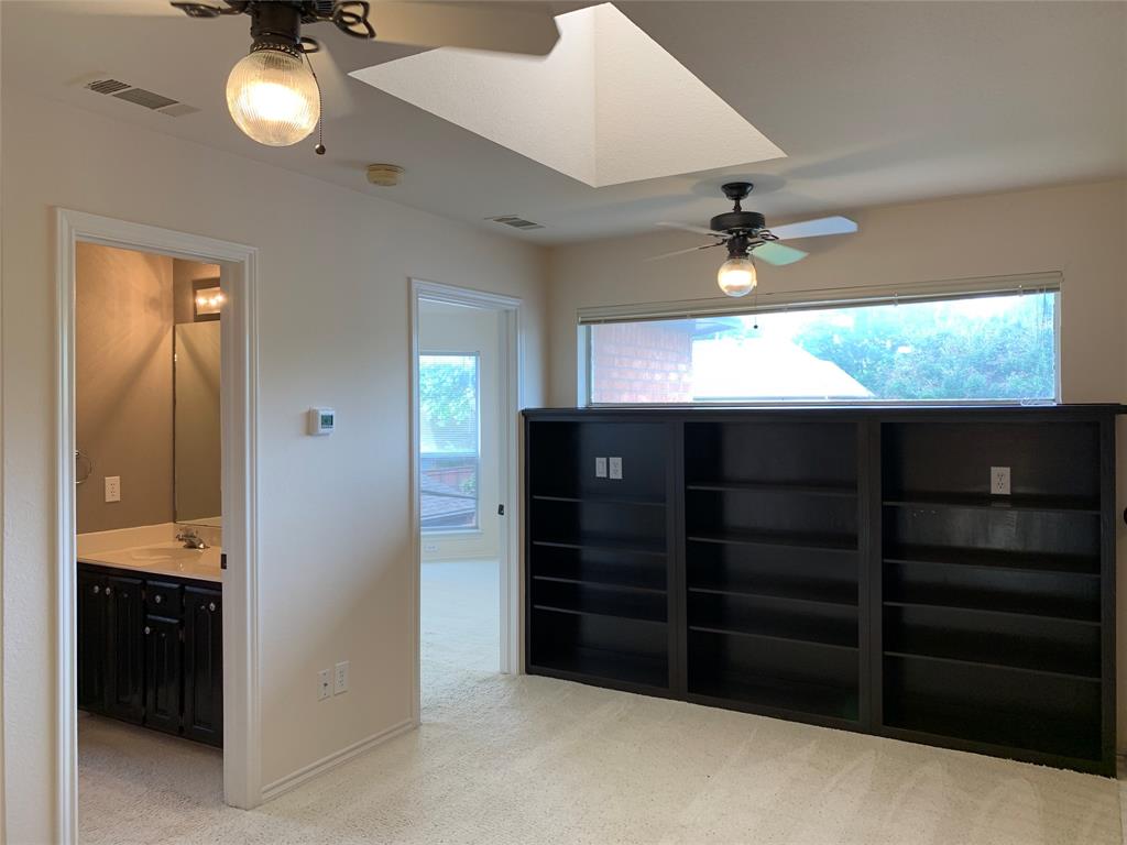 5009 Promise Land Drive Frisco, TX 75035 - Photo 6 of 9 Empty room with a ceiling fan and light colored carpet
