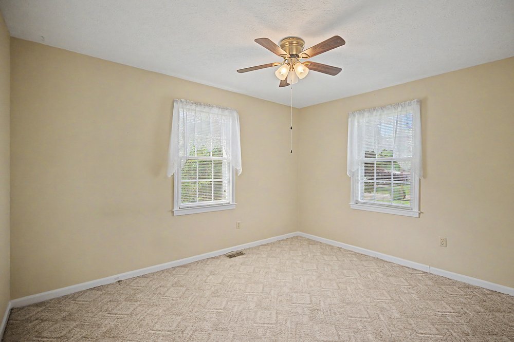 115 Brunson Drive Pickens, SC 29671 - Photo 17 of 29 A quiet retreat with a textured carpet and ample natural light from two windows.