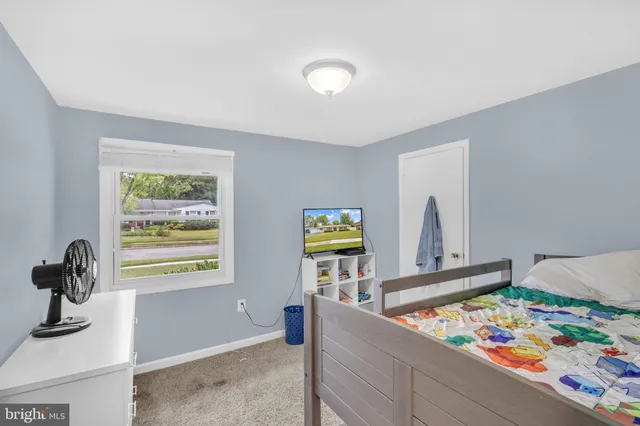 a view of hallway with window and couch