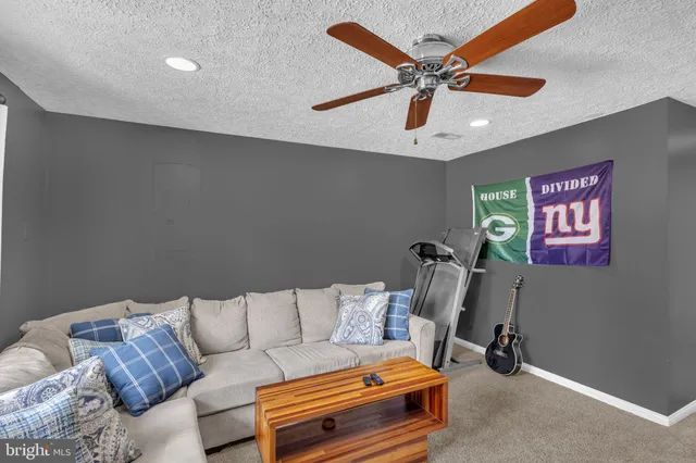 a bathroom with a sink a toilet and shower curtain