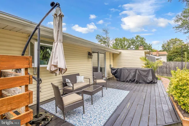a view of a two chairs in the balcony
