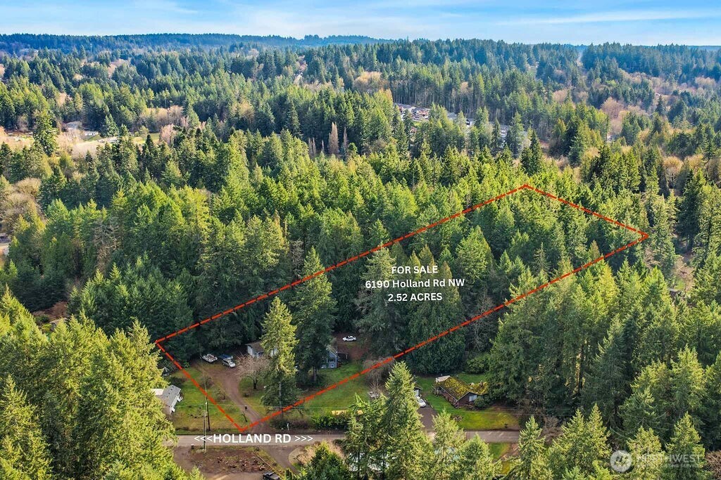 6190 Holland Road Northwest Bremerton, WA 98311 - Photo 5 of 10 a view of a city with lush green forest