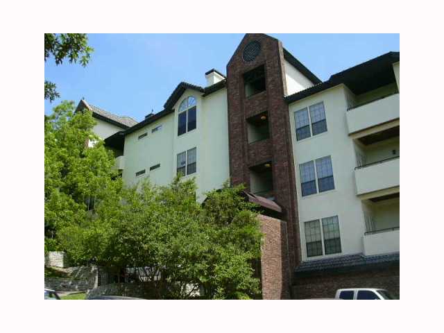 3001 Cedar Street, Unit 217 Austin, TX 78705 - Photo 1 of 1 a view of a house with a small yard