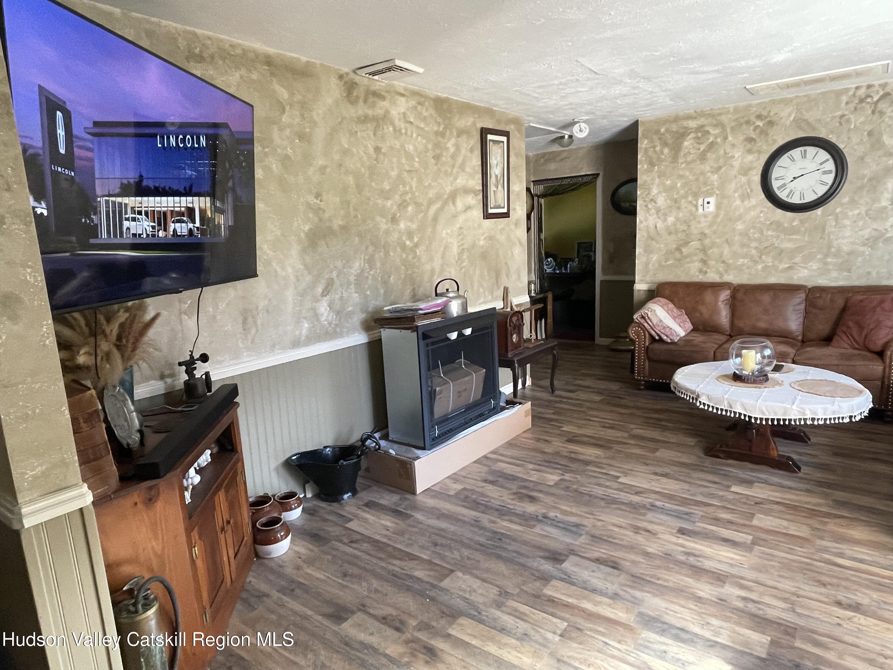 10 Johns Road Kerhonkson, NY 12446 - Photo 9 of 30 a living room with furniture and a mirror