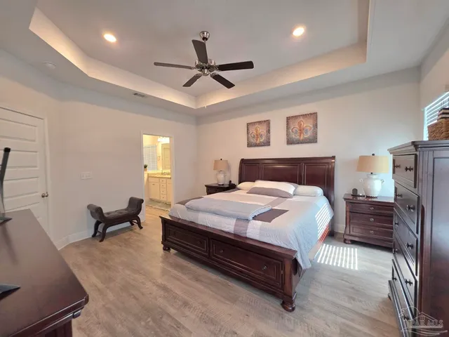 a bedroom with a bed and furniture