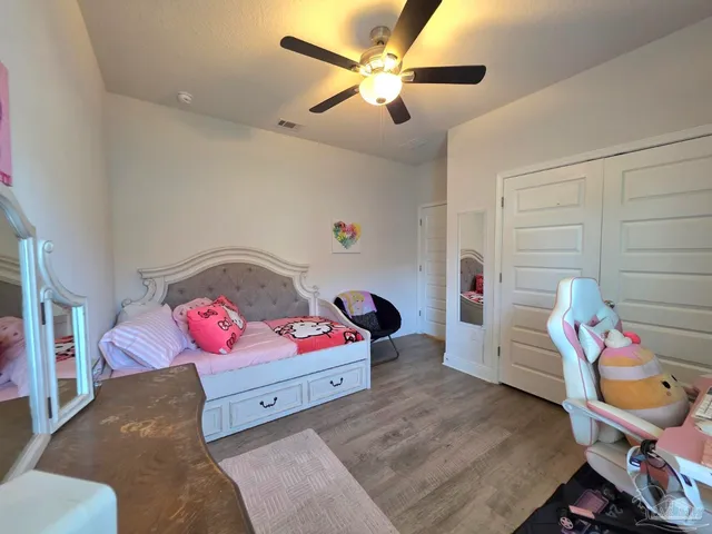 a bedroom with furniture and a bed