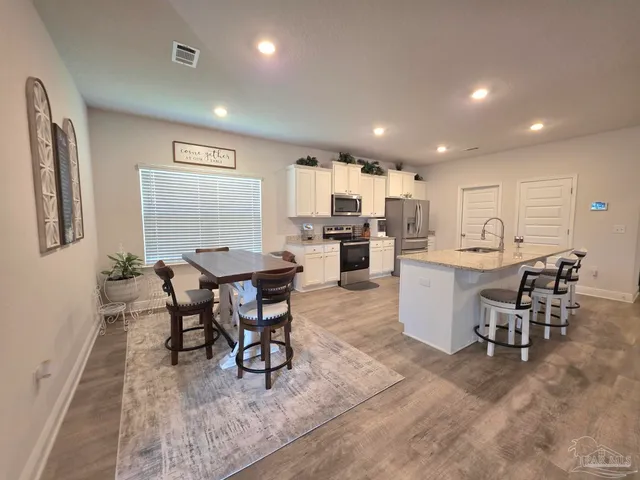 a view of a dining room with furniture