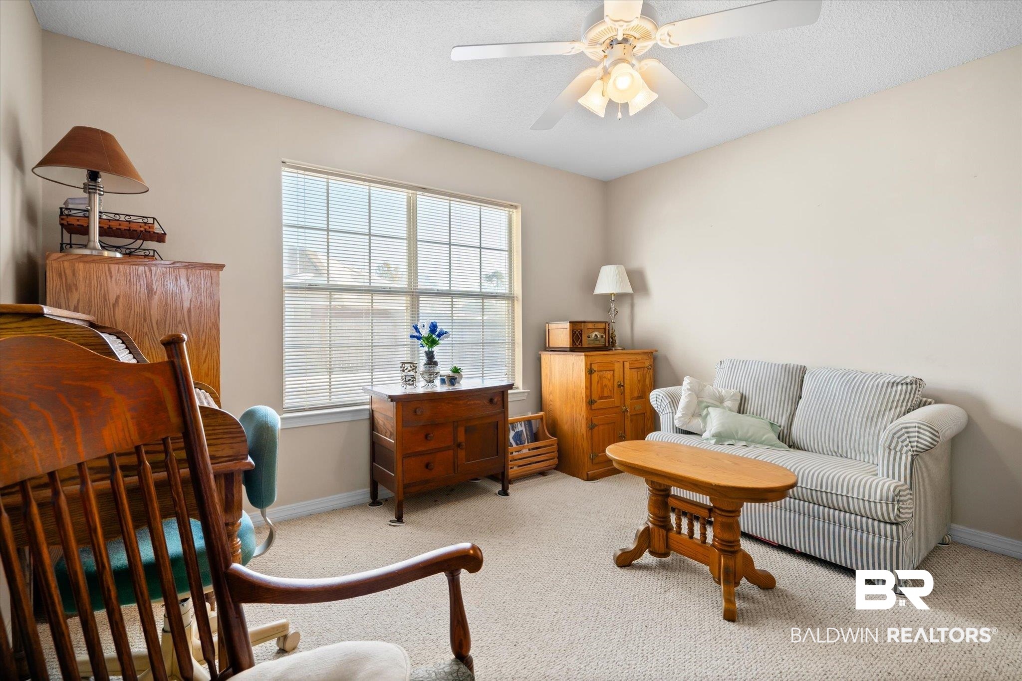 8374 Kipling Court Mobile, AL 36695 - Photo 16 of 20 Living area featuring light colored carpet and ceiling fan