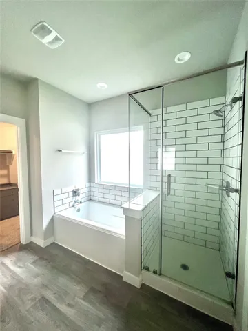a bathroom with a shower and a sink