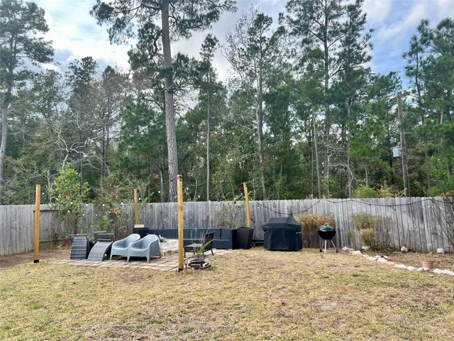 a backyard of a house with seating space