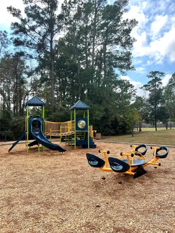 a view of a backyard with a table and chairs