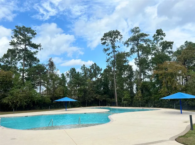 a view of a swimming pool and an outdoor space