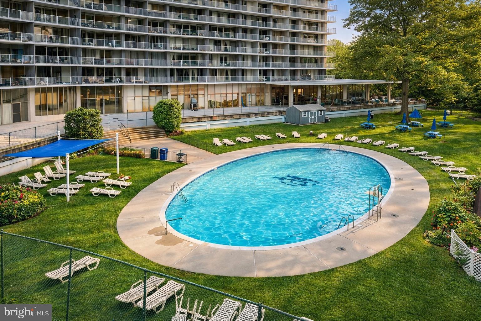 3900 West Ford Road, Unit 9K Philadelphia, PA 19131 - Photo 16 of 17 swimming pool with outdoor seating and yard