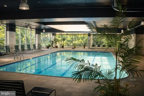 a view of swimming pool with outdoor seating