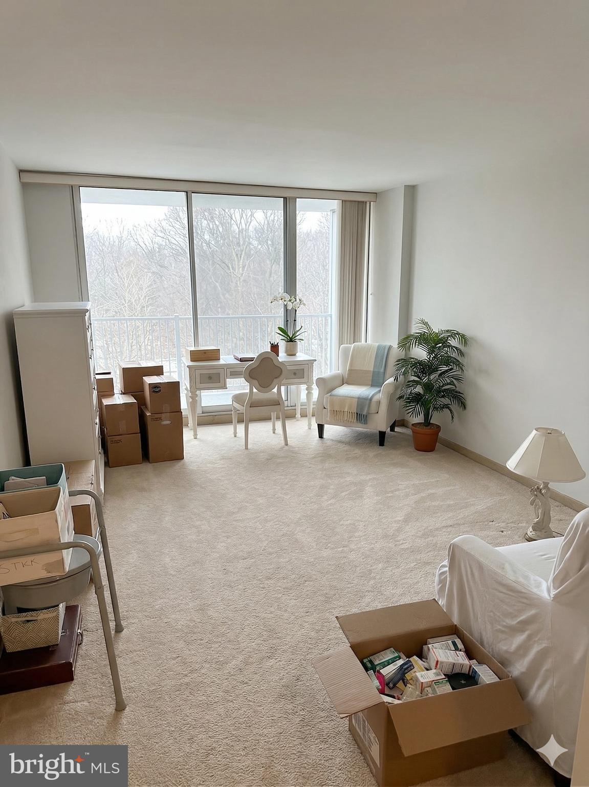 3900 West Ford Road, Unit 9K Philadelphia, PA 19131 - Photo 6 of 17 a living room with furniture and a large window