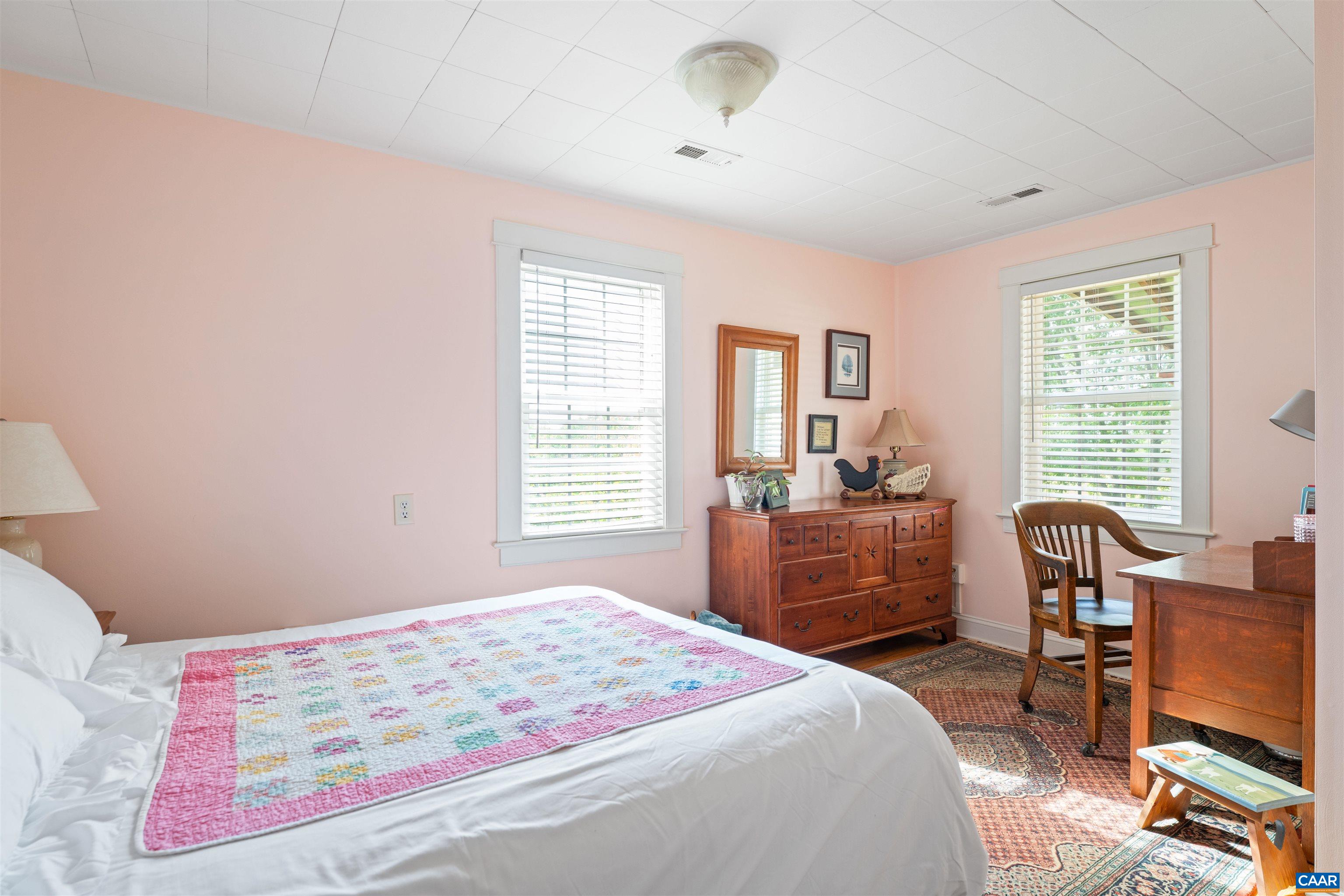 3486 Fredericksburg Road Ruckersville, VA 22968 - Photo 16 of 37 a bedroom with a bed and wooden floor