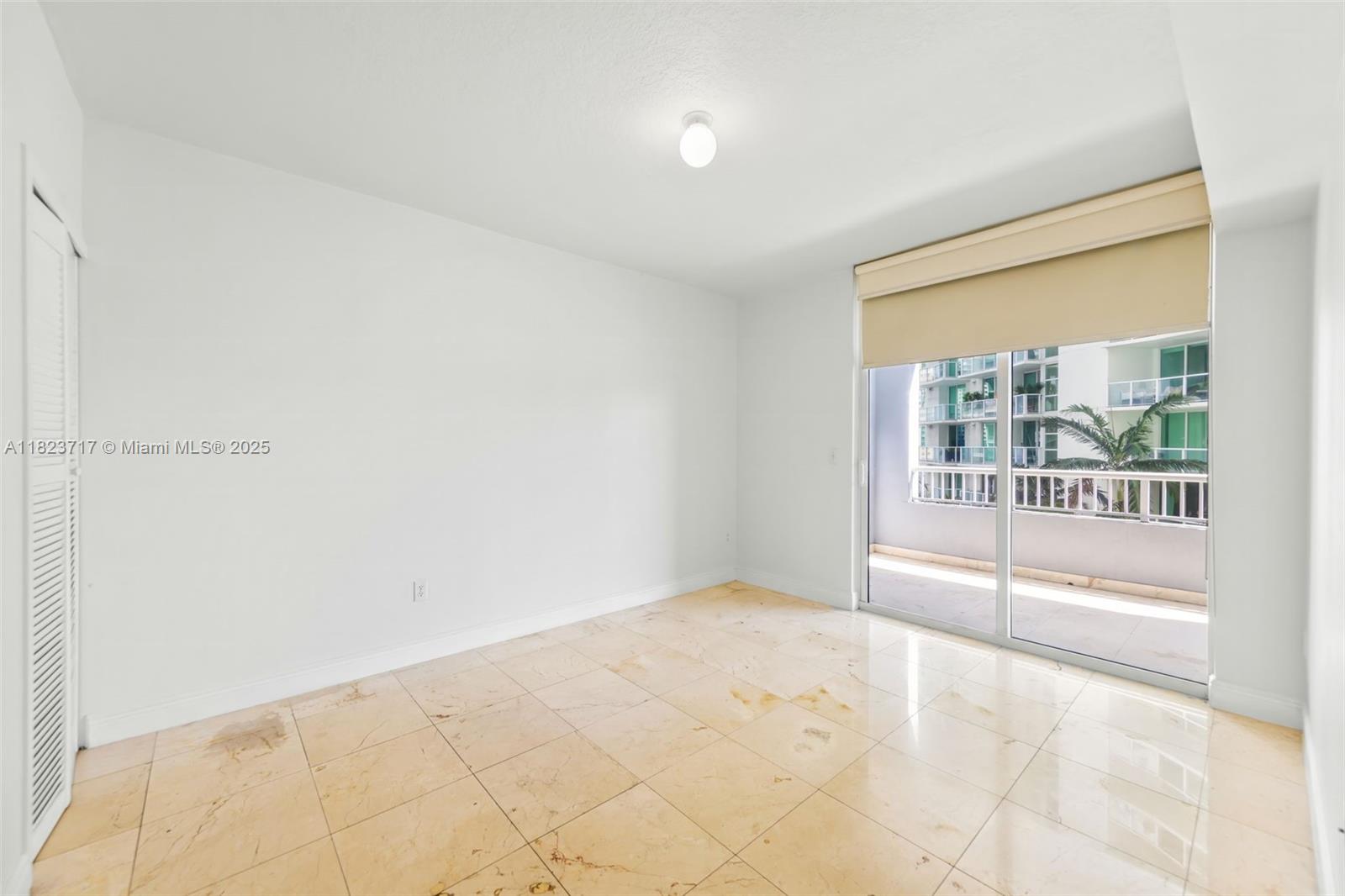 170 Southeast 14th Street, Unit 1203 Miami, FL 33131 - Photo 11 of 24 a view of an empty room and window