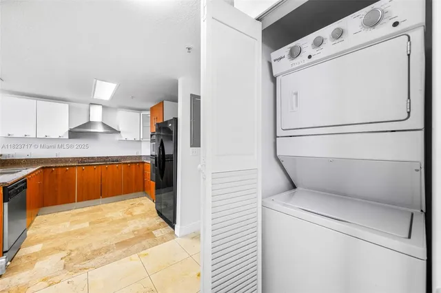 a kitchen with a refrigerator and a sink