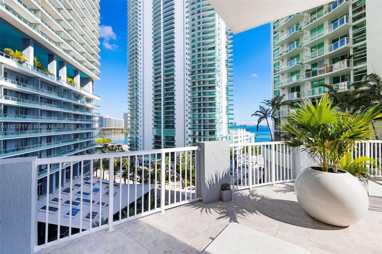 170 Southeast 14th Street, Unit 1203 Miami, FL 33131 - Photo 22 of 24 a view of a balcony with a floor to ceiling window