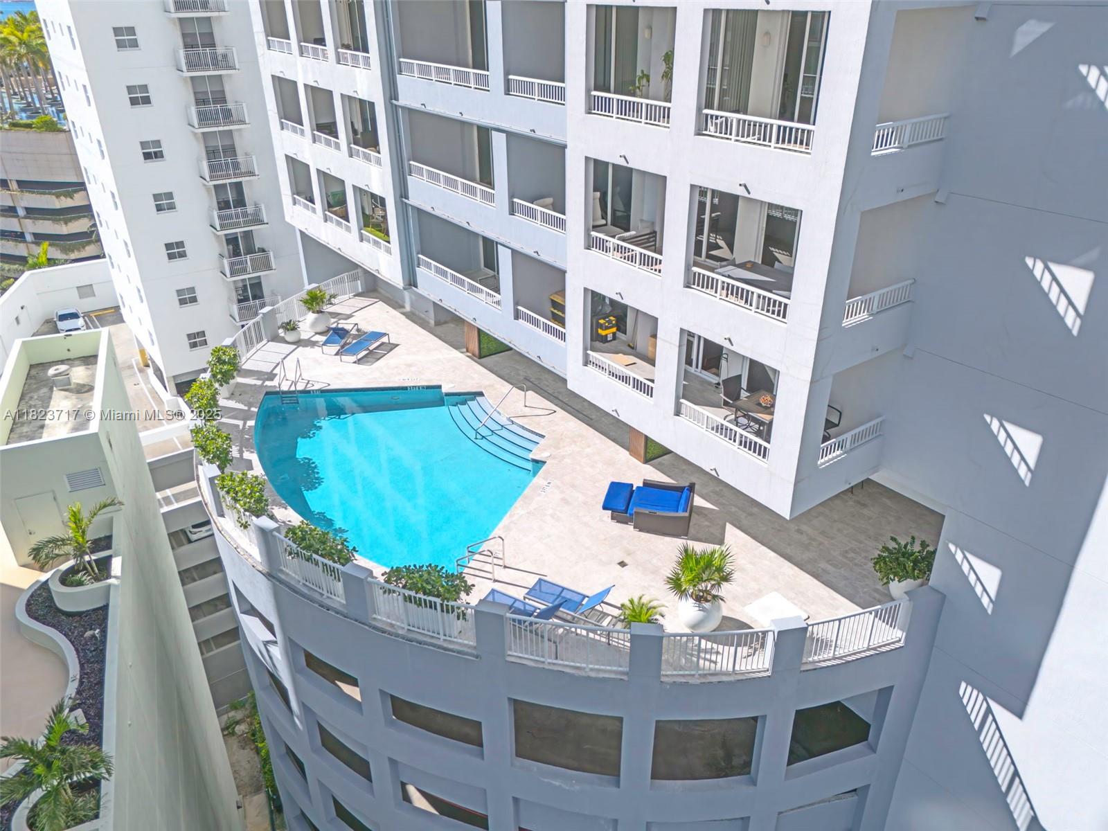 170 Southeast 14th Street, Unit 1203 Miami, FL 33131 - Photo 23 of 24 a view of building with an outdoor space