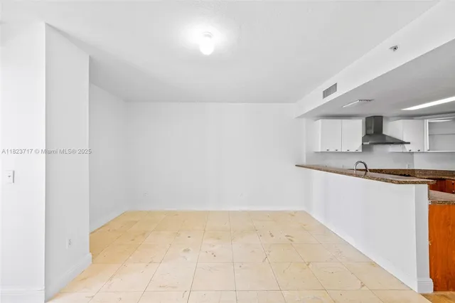 a view of a kitchen with a sink