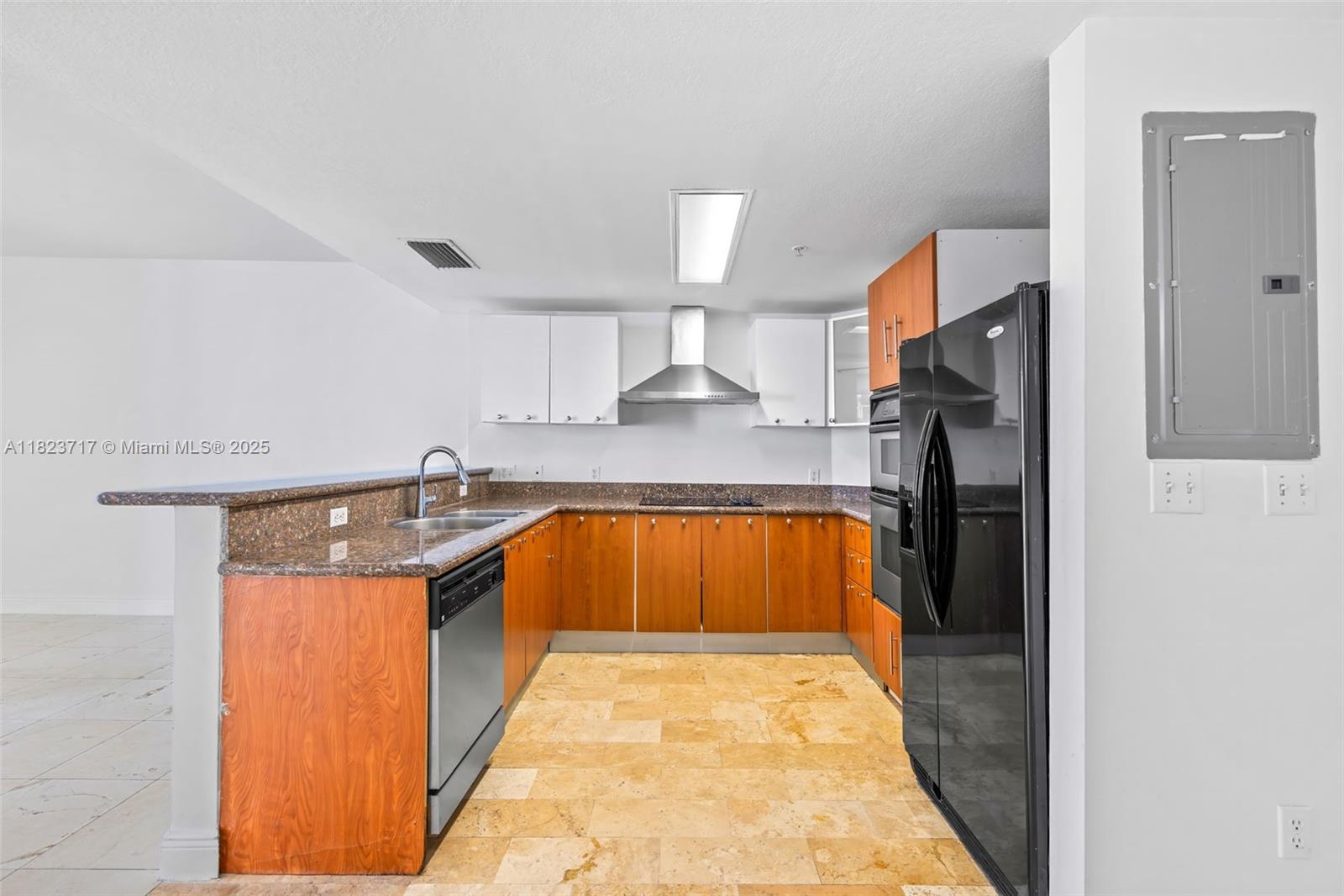 170 Southeast 14th Street, Unit 1203 Miami, FL 33131 - Photo 8 of 24 a kitchen with stainless steel appliances granite countertop a stove a sink and a refrigerator